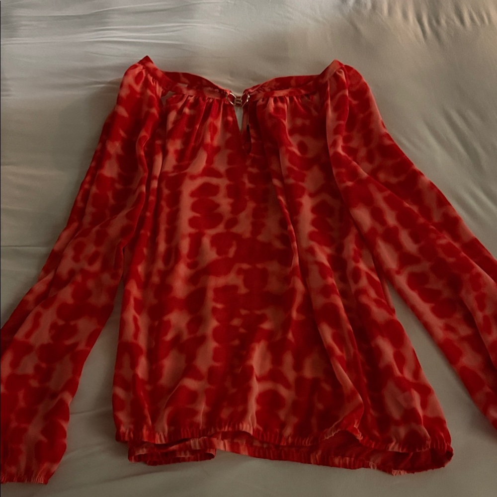 Jennifer Lopez Vibrant Orange Blouse